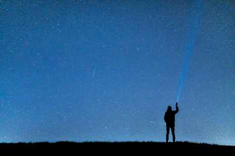 silhouette of man under blue sky during nighttime